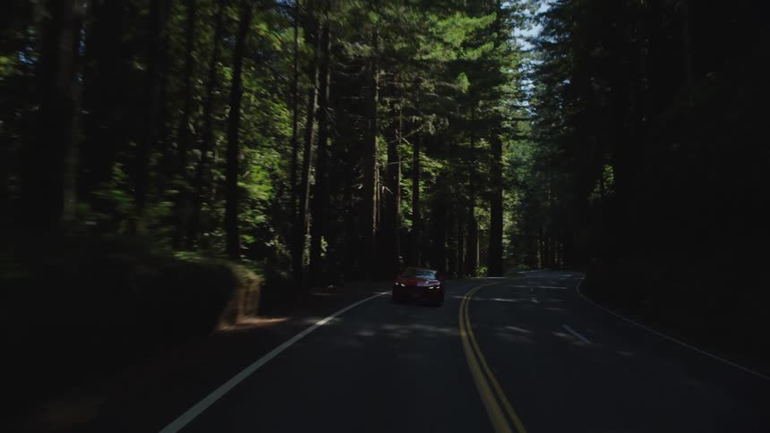 A car drives down the road