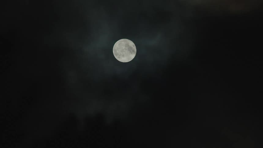 A moon in the night sky