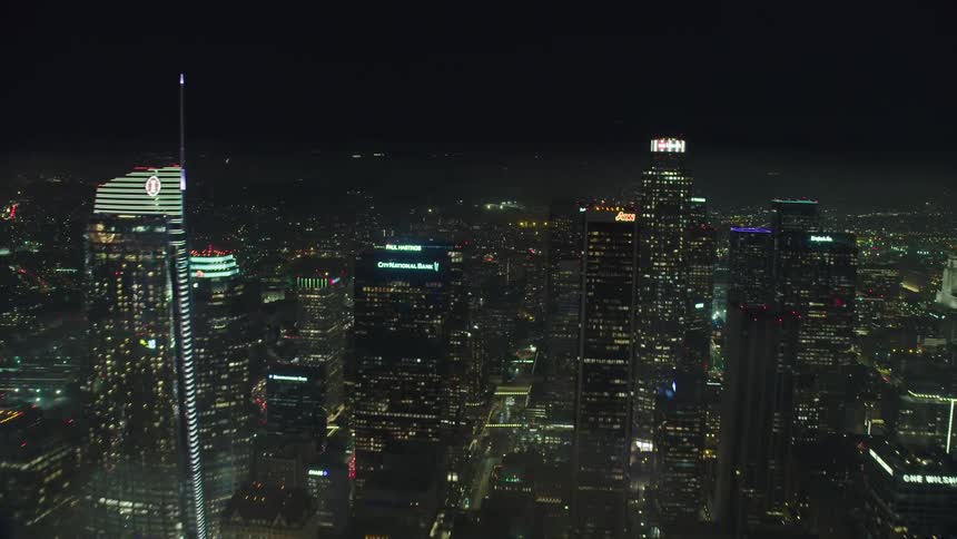 Cars drive on freeways in a large city