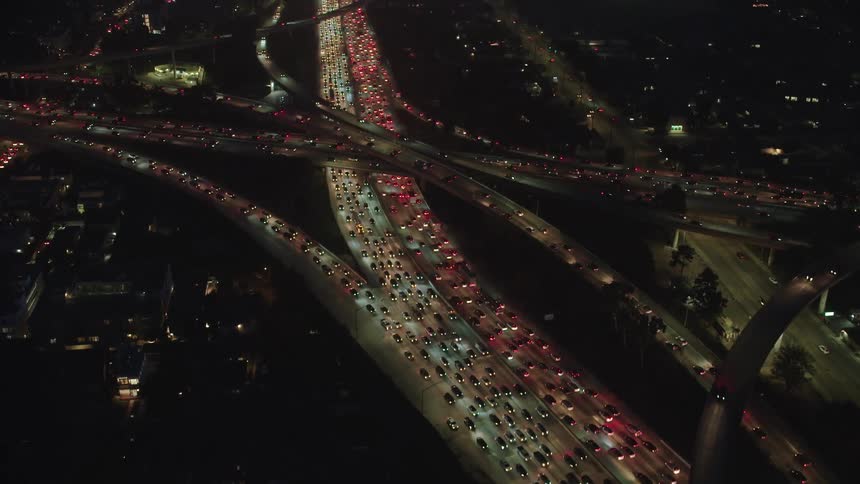 Heavy traffic on freeway interchange at night