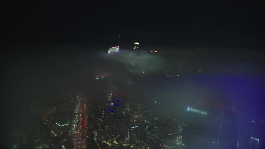 The smoke is heavy through the skyscrapers