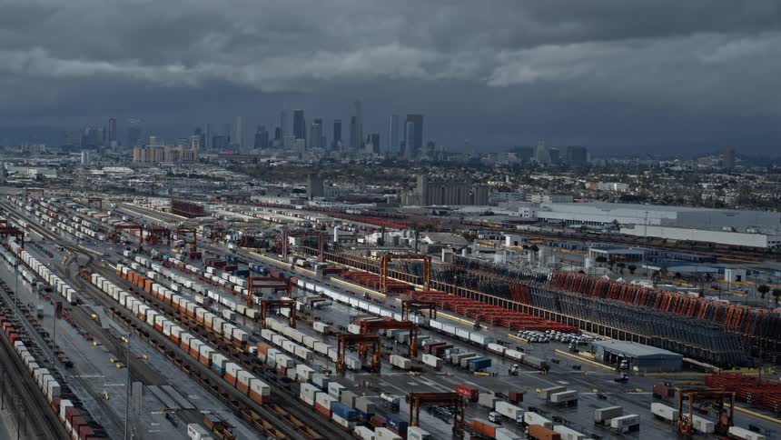 A shipping factory with the city skyline in the distance