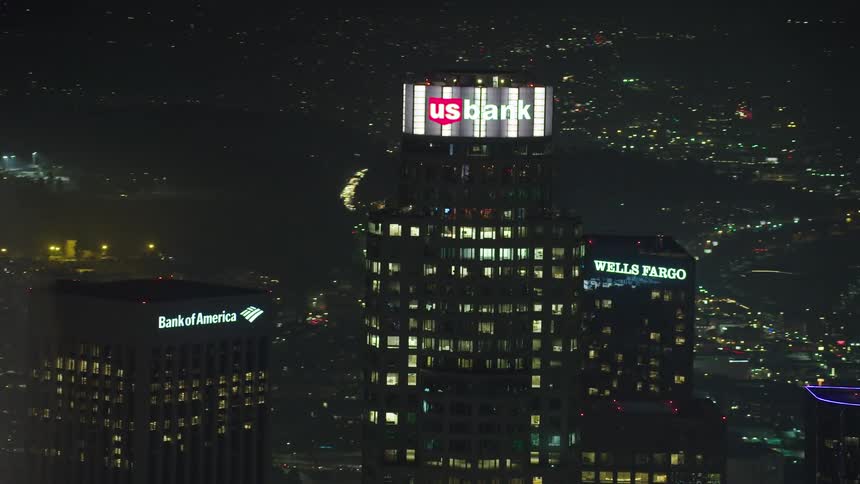 Lit up skyscrapers in a city