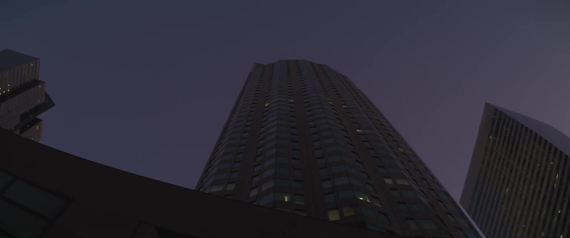 A skyscraper in a city during the night