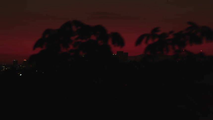Red sky at sunset over city skyline