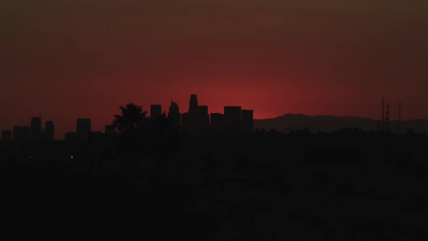 Skyline of the distant city with urban skyscrapers at dawn