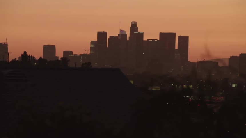 Skyline of the city with tall buildings and skyscrapers at dusk