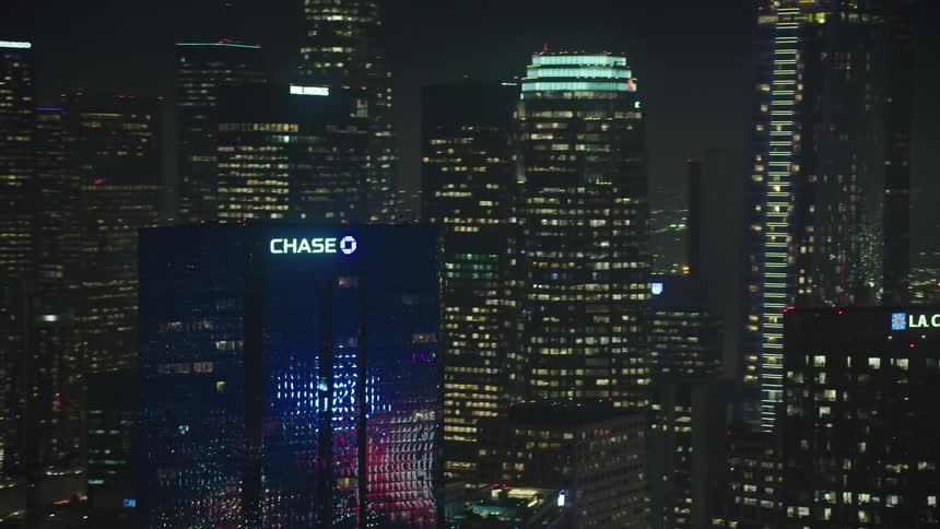 The city si full of tall brightly lit buildings