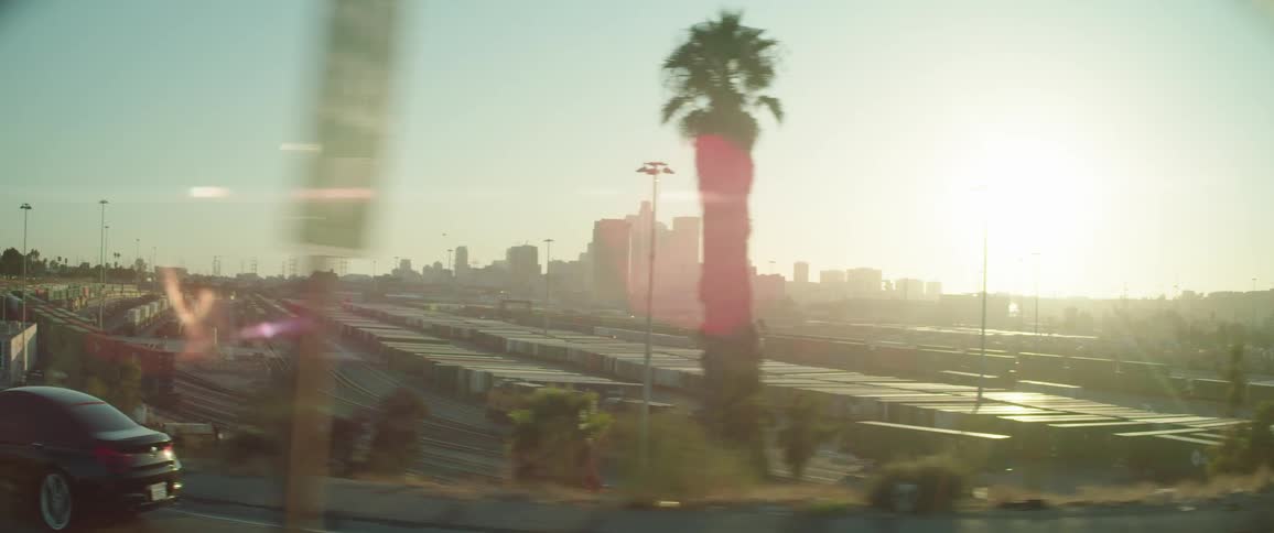 Distant cityscape with urban skyscrapers at sunset