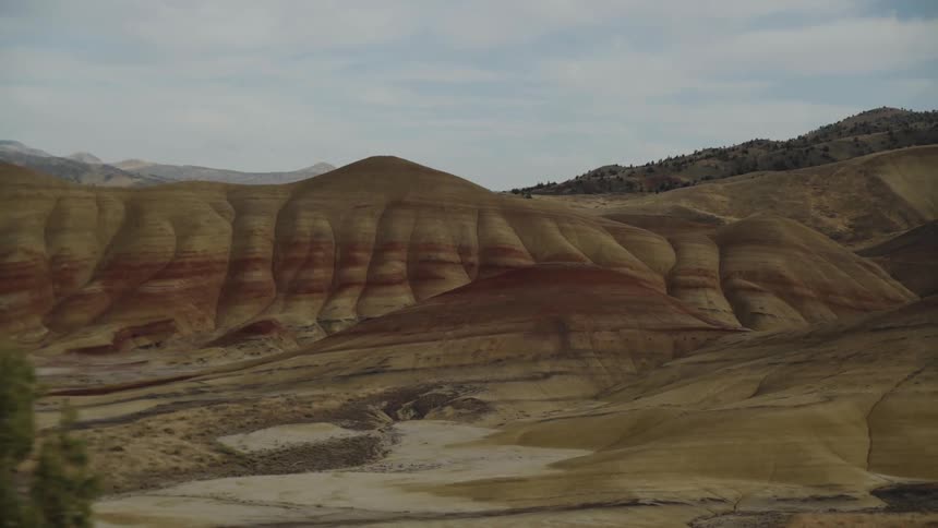 The hills are high and covered with shades of brown