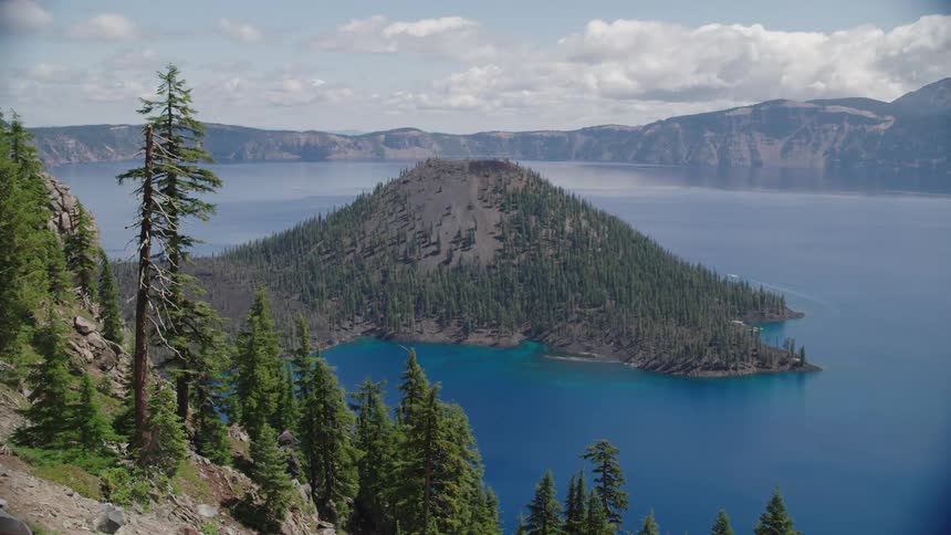 The water is blue in the lake near the range