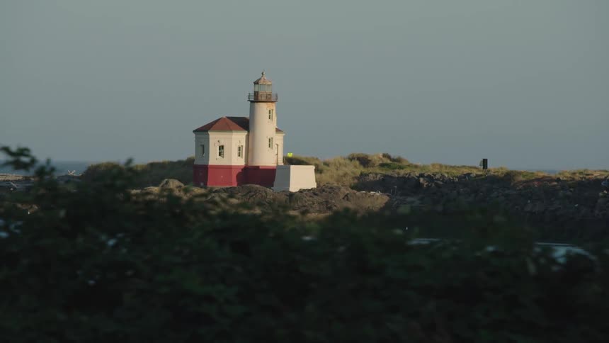 Lighthouse on rocky peninsula