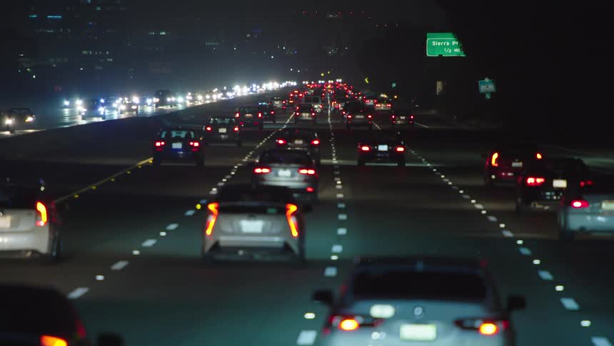 The highway is busy with many cars