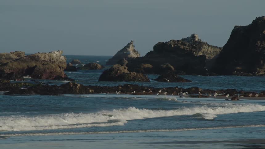 Waves of water are moving towards the coast