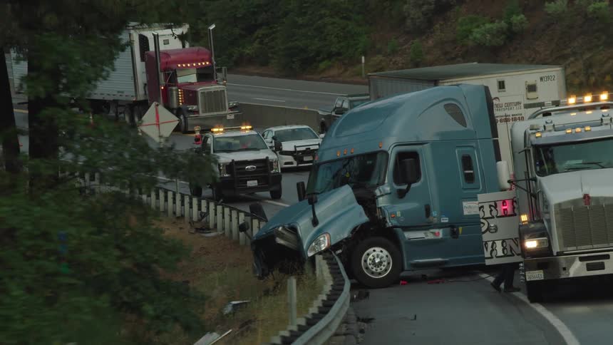 Tow truck and semi truck at scene of accident on highway