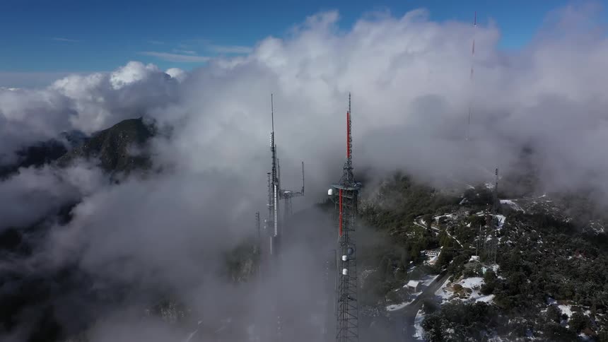 Large antenna sticking up through the clouds