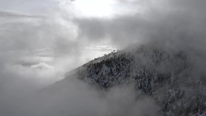 The clouds over the top of the mountain