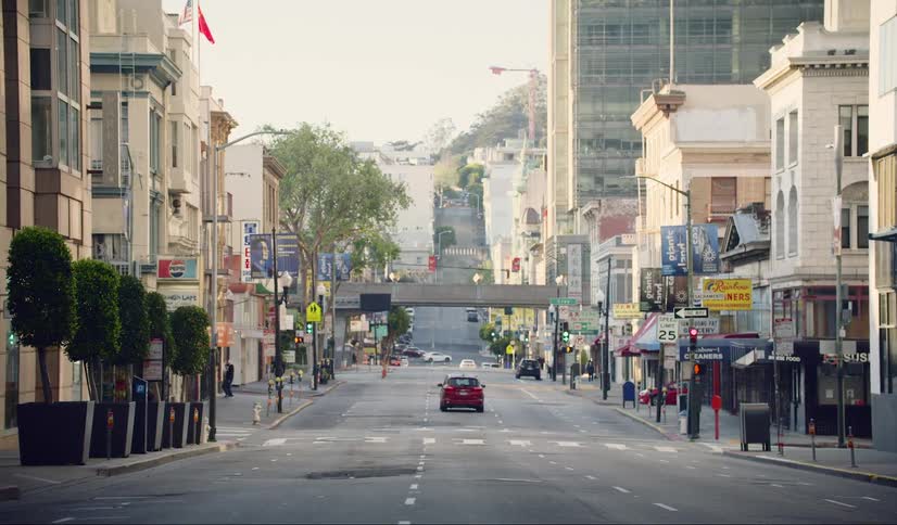 Pedestrians and cars on a quiet city street