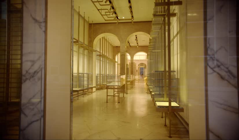 A room with displays and arch doorways