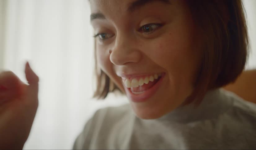 Woman makes a video call with her friends at home