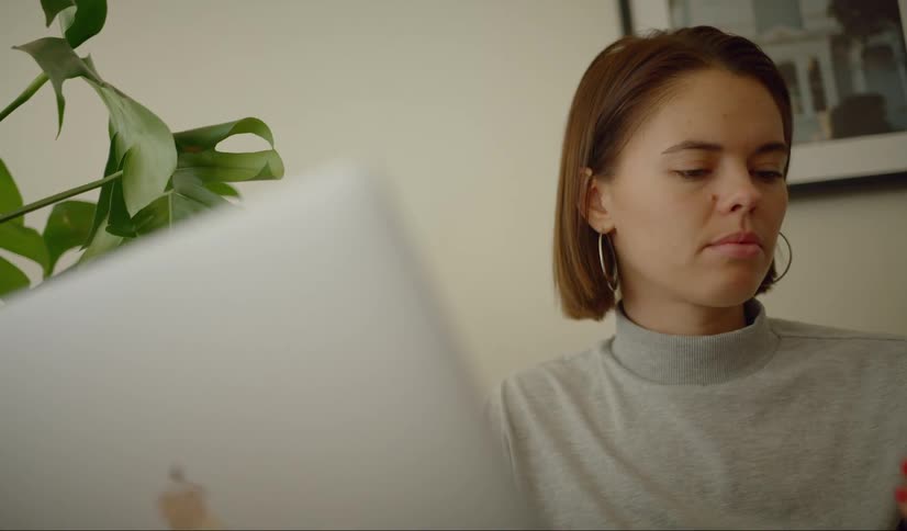 A young female answering her telephone