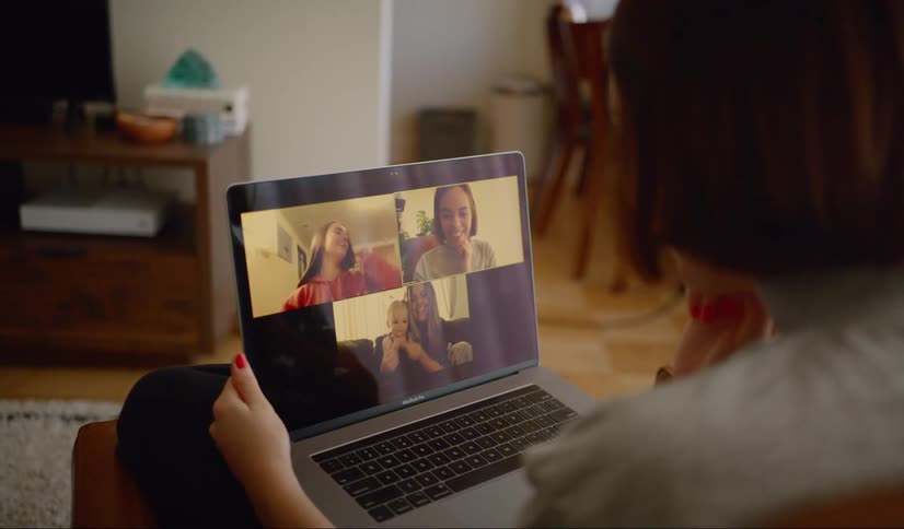 Woman having video call from home on laptop