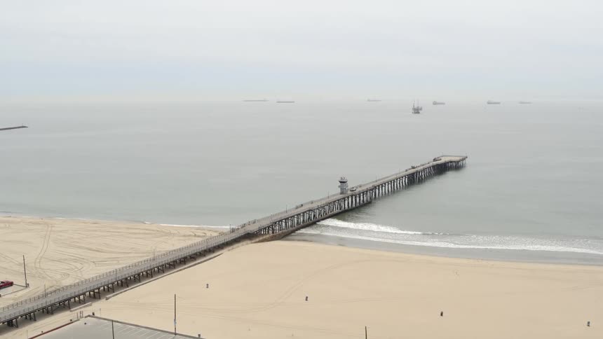 Aerial of a closed beach on a foggy day
