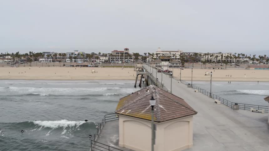 A pier stretches out into the ocean