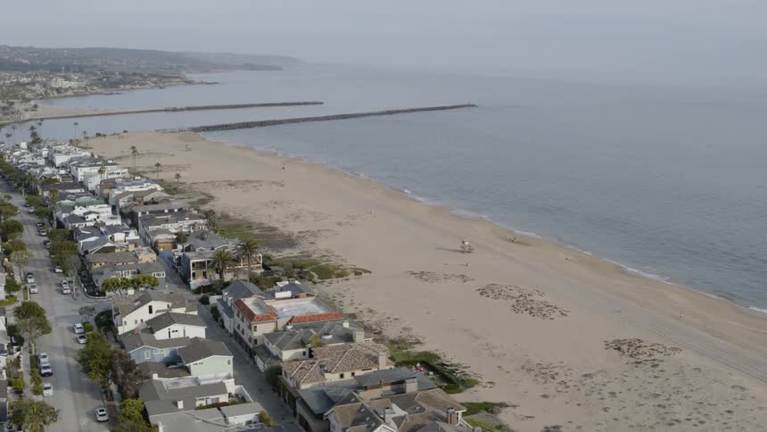 Aerial view of beach front neighborhood with beach