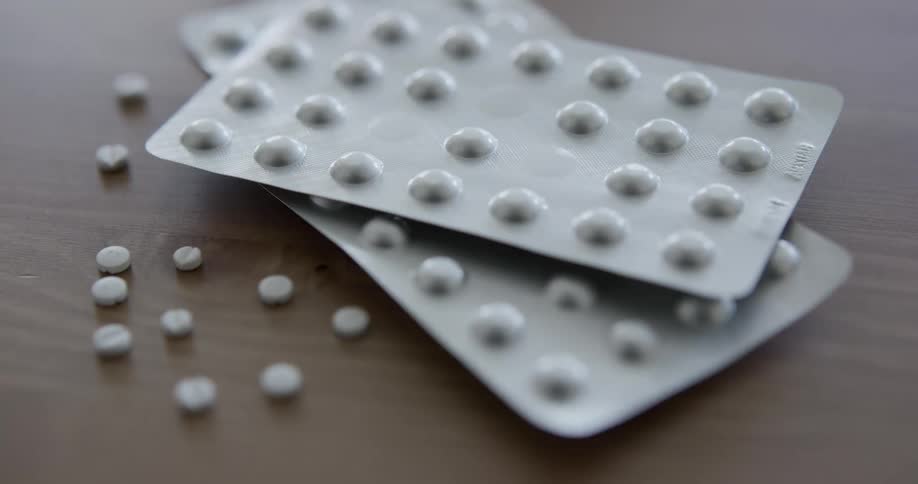 Blister of medicine pills on table