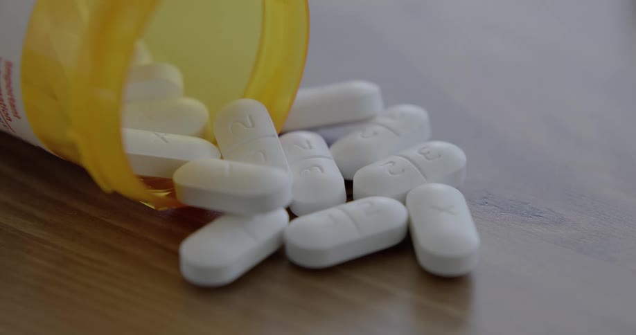 White pills spilled out on the table