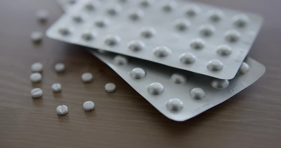 Pills sit on a table