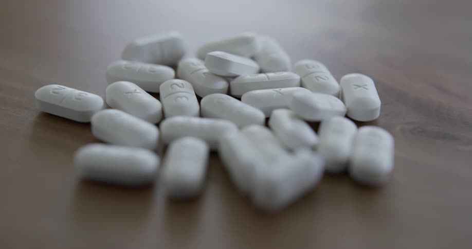 Medication pills on table indoors