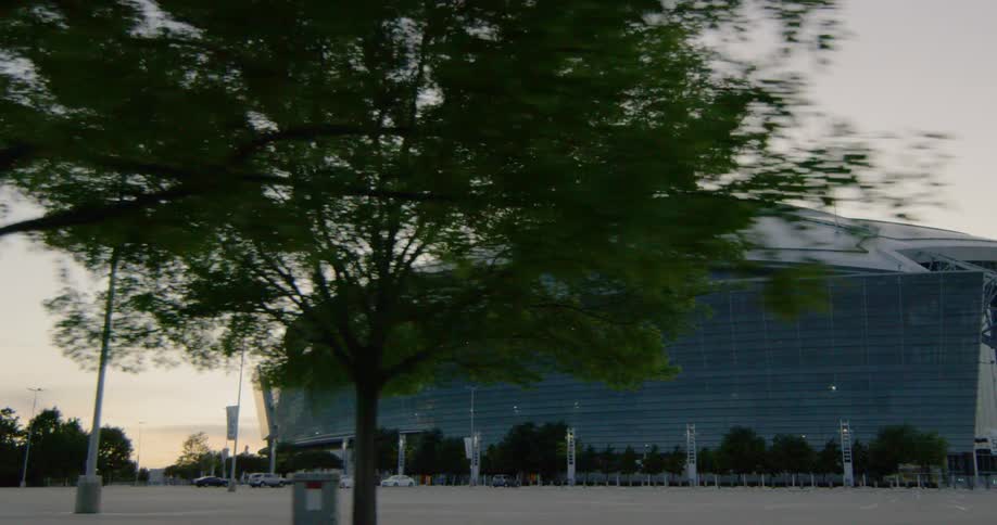 Cars parked outside a sports stadium