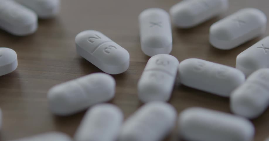 Pills spilling on table