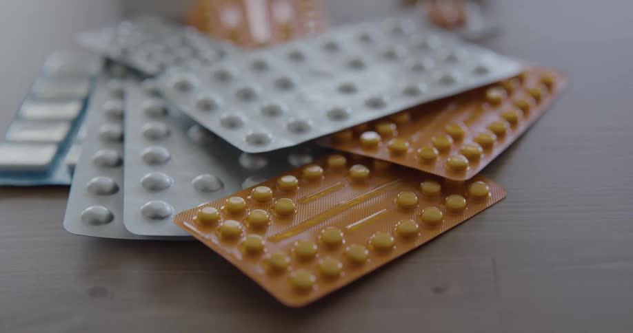 Packages of pills on a table