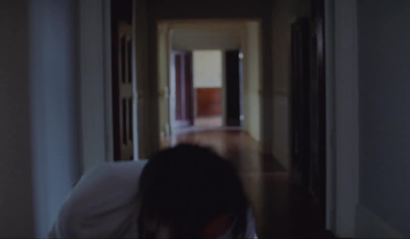 Man stumbles into hall tripping and falling as he walks