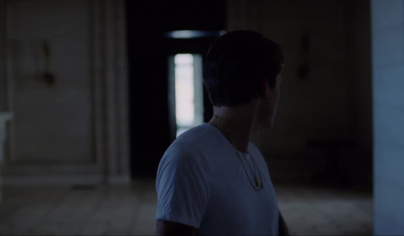 Man walks along the hall in the luxurious house