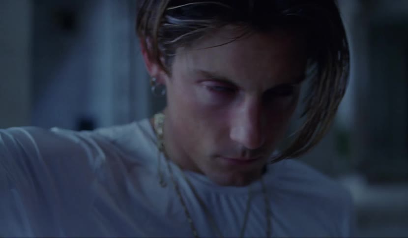 A teen moves about as his eyes roll back in his head