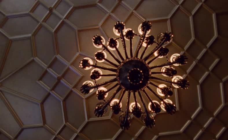 Worms eye view of a chandelier on a ceiling