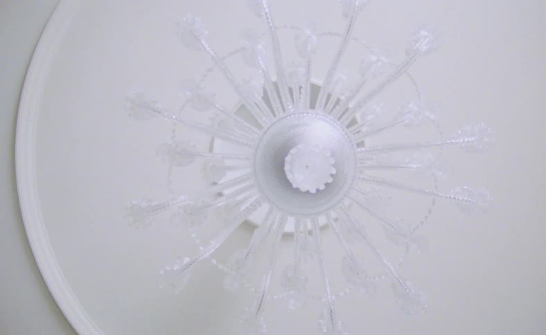 A chandelier hangs on the ceiling