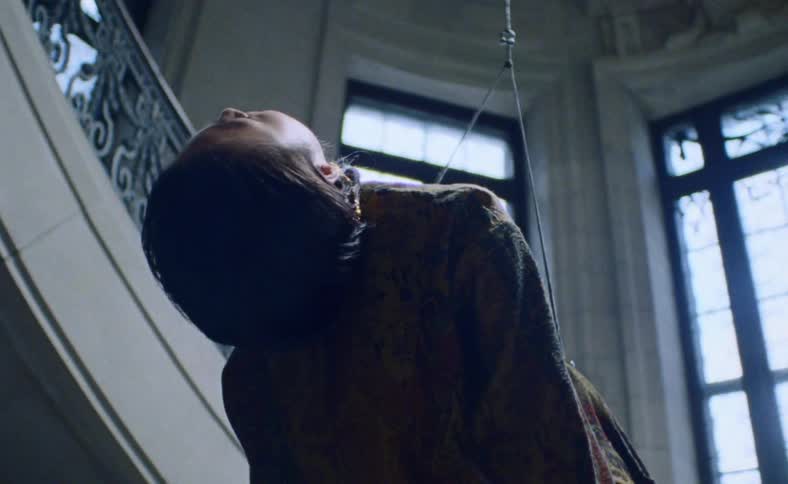 Asian womans body hanging dead from ceiling in the luxurious house