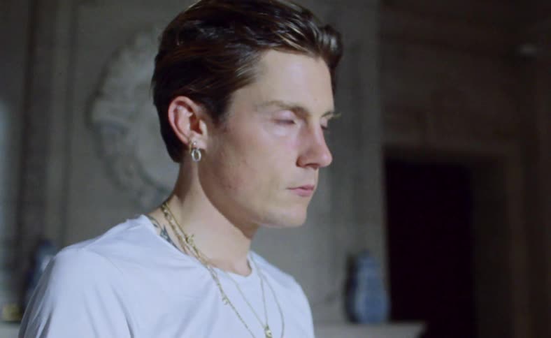 A teen moves his head around as his eyes flutter and roll back