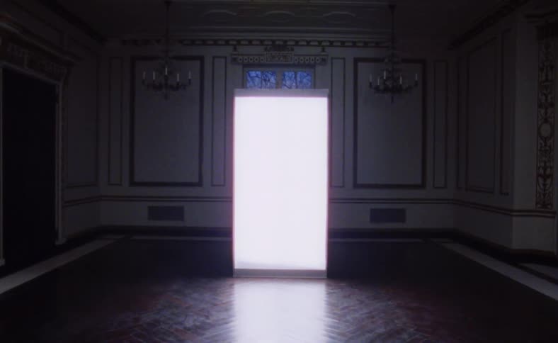 A large panel stands in an empty room glowing white light