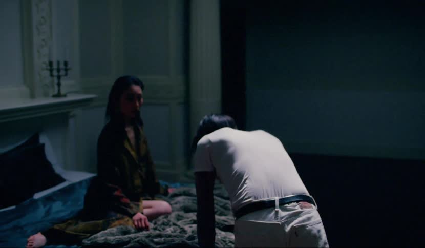A fight between a man and woman in the bedroom