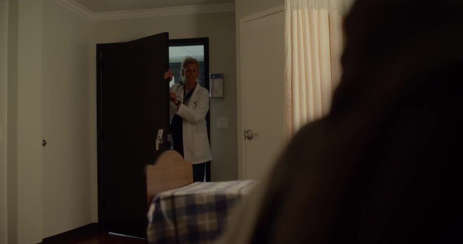 Female doctor enters the sickroom in the hospital