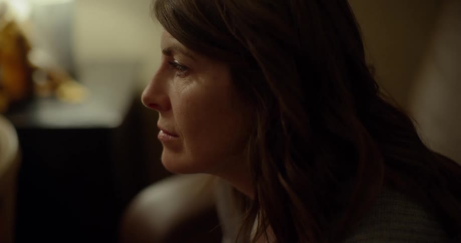 Woman sits thinking and nodding as she listens