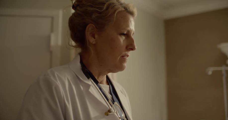 A doctor talking to an unseen patient