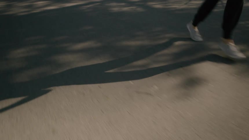 A woman runs down a street