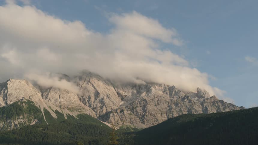 A time lapse of a cloud front over a mountain